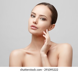 Beautiful Face Of Young Woman With Clean Fresh Skin Close Up Isolated On White. Beauty Portrait. Beautiful Spa Woman Smiling. Perfect Fresh Skin. Pure Beauty Model. Youth And Skin Care Concept