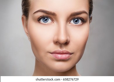Beautiful face of young woman with perfect skin.