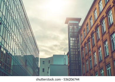 Beautiful Factory Or Office Buildings In Vanishing Point Perspective With Sunlight In The Middle