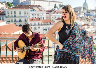 Beautiful Fado Singer Performing With Handsome Portuguese Guitarist Player