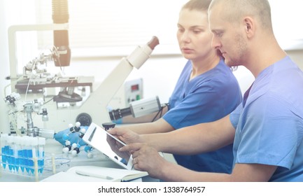 Beautiful Fair-haired Technologist With Clipboard And Pen In Hands Standing At Conveyor Belt And Controlling Production Process At Modern Soy Milk Factory, Portrait Shot