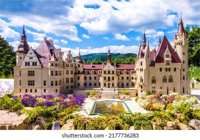 A beautiful fairytale castle with a park and a fountain. Castle palace exterior. Fairytale castle palace landmark. Castle palace view - Shutterstock ID 2177736283