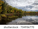 Beautiful fall colors reflected in McGrath lake in northern Wisconsin.