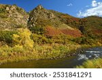 Beautiful fall scene with a mountain backdrop  next to the south platte river  in  waterton canyon, littleton, colorado  