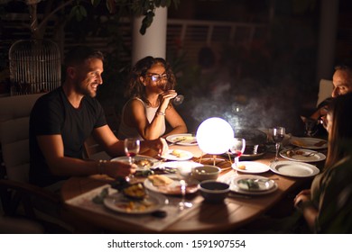 Beautiful family on dinner talking and smiling at terrace - Shutterstock ID 1591907554