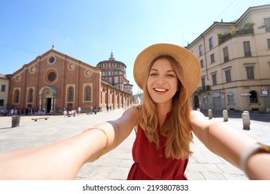 Beautiful fashion girl takes self portrait with the church of Santa Maria delle Grazie which preserves "The Last Supper" by Leonardo da Vinci, Milan, Italy - Shutterstock ID 2193807833
