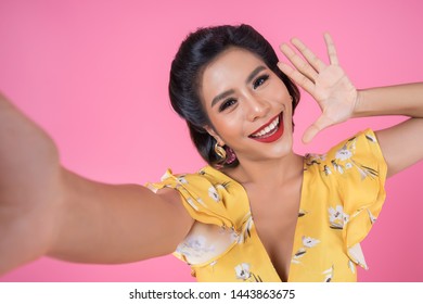 Beautiful Fashion women take a photo selfie with her phone - Shutterstock ID 1443863675