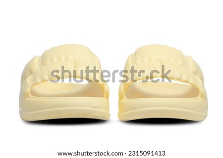 Beautiful fashion yellow sandals isolated on white background with clipping path. yellow women's rubber slippers