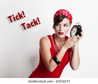 Beautiful And Fashion Young Woman With A Pin-up Look Holding A Clock