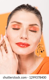 Beautiful Fashionable Young Woman Posing With Eyes Closed And Tumeric On Background