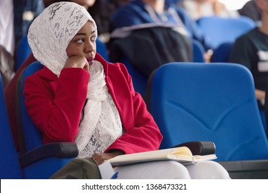 Beautiful Female Afro Hijab Muslim  Student Listen Carefully During Seminar. Study Event, Workshop, Plan Creative Job, Customer Support Service, Case Hear In Court, Leader Performance Concept.