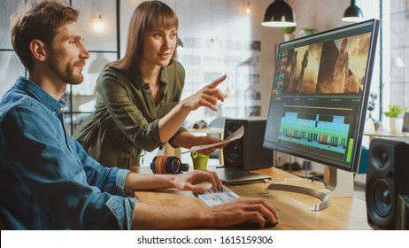 Beautiful Female Art Director Consults Handsome Video Editor Colleague, They Work on a Video Project About Astronauts. They Work in a Cool Office Loft. They Look Very Creative and Cool. - Powered by Shutterstock