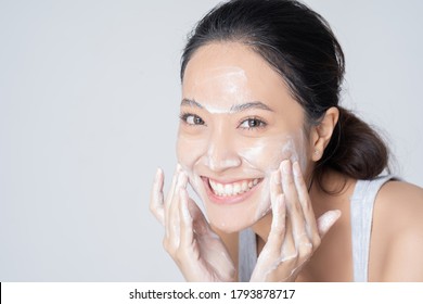 Beautiful Female Asian Wash Face In Studio