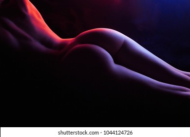 Beautiful Female Back and Booty. Rainbow Woman Body silhouette, in colorful bright lights posing Nude. Art design, colorful Naked girl