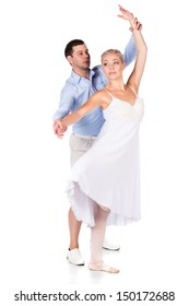 Beautiful Female Ballet Dancer And Her Instructor Isolated On A White Background. Ballerina Is Wearing A White Feathered Dress And Pointe Shoes. Instructor Is In Plain Clothes.