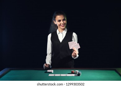 Beautiful Female Banker At Table In Casino