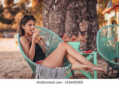 Beautiful Female In Beach Bar Eating Fruit Salad