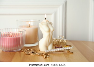 Beautiful Female Body Shape Candle On Wooden Table. Stylish Decor