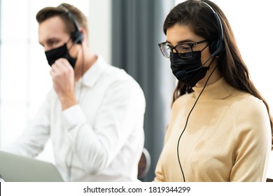 Beautiful Female Call Center Operator Working On Computer In Office. Communication Support For Callcenter And Customer Service Helpdesk.Worker Wearing Face Mask Prevent Covid-19 Virus