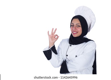 Beautiful female chef gesturing the ok sign wearing black scarf and the uniform isolated on a white background. - Powered by Shutterstock