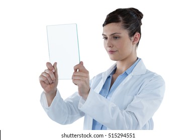 Beautiful Female Doctor Holding Digital Tablet Against White Background