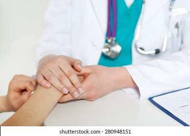 Beautiful Female Doctor Holding Patient's Hand For Encouragement And Empathy And Touching Her Arm. Partnership, Trust And Medical Ethics Concept. Bad News Lessening And Support. Patient Cheering