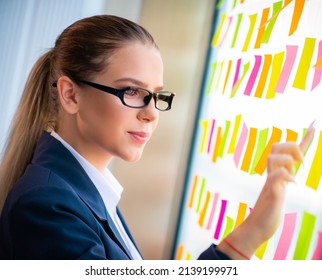 The beautiful female employee with many conflicting priorities - Shutterstock ID 2139199971