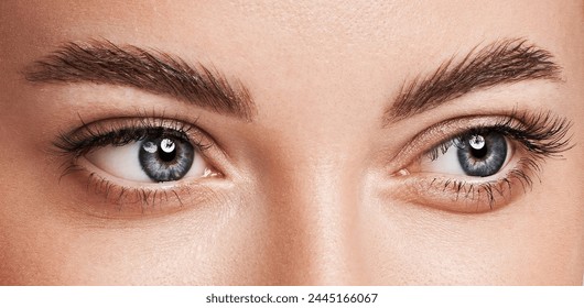 Beautiful female eyes with long eyelashes. Eyelash extensions. Makeup, cosmetics, beauty. Close up, macro - Powered by Shutterstock