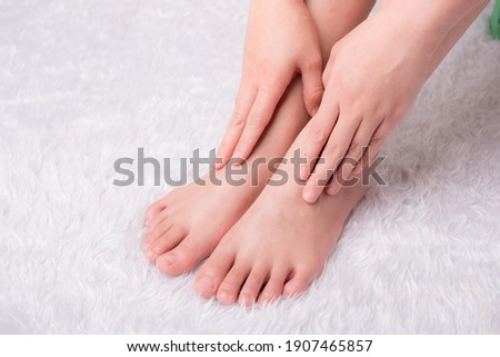 Beautiful female feet, with smooth and soft heels, close-up on a white background. Copy space. Concept of cosmetology, dermatology and health