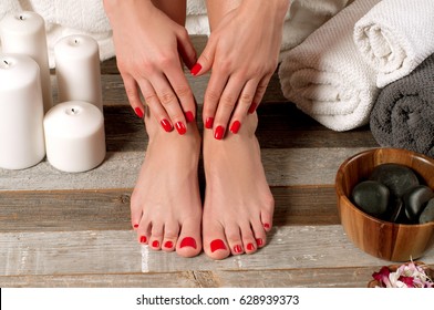 Beautiful female feet at spa salon on pedicure procedure 