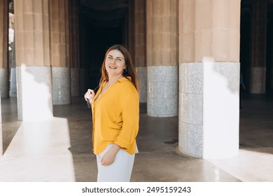 Beautiful female in Gaudi garden, Spain, Barcelona. Young traveling woman posing outdoors. Concept of travel, tourism and vacation in city. Hypostyle hall - Powered by Shutterstock