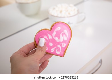 
Beautiful Female Hand Holding Candy In Shape Of Heart