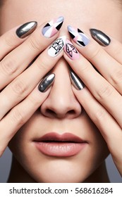 Beautiful Female Hands Cover Her Face.manicure. Close-up Fashion Portrait.Model Girl Face. Make-up And Nails