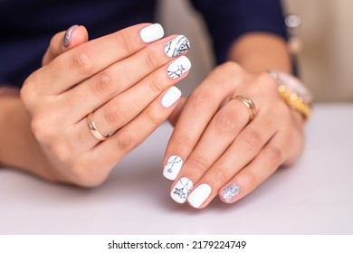 Beautiful Female Hands With Fashion Manicure Nails, White And Silver Gel Polish, Stars Design