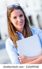 Beautiful Female Intern With A Laptop Outdoors