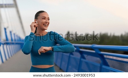 Similar – Image, Stock Photo Young athletic caucasian listening to music at sunset