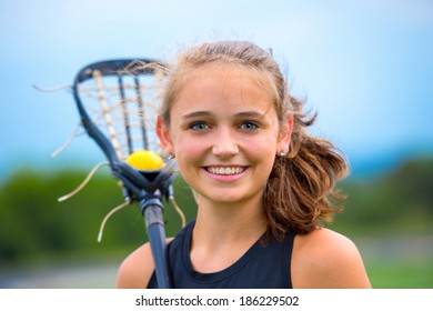 Beautiful Female Lacrosse Player Portrait, Outdoors Before Game.