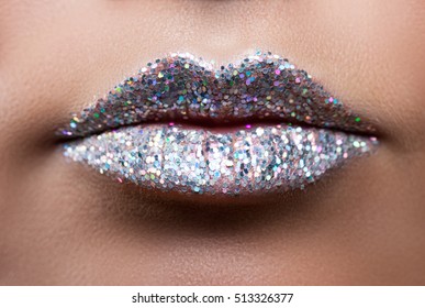 Beautiful female lips closeup. Lips in sequins. Metal sequins. Glitter.