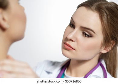 Beautiful Female Medicine Doctor With Serious Face Examine Patient. Medical Care, Illness Diagnosing, Physical, Physician Consultation, Isurance Concept. Dermatologist Or Oncologist Examination