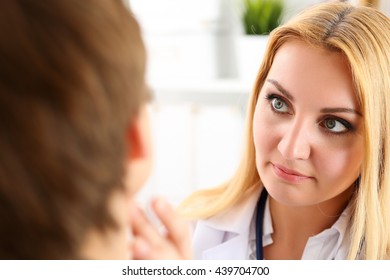 Beautiful Female Medicine Doctor With Serious Face Examine Patient. Medical Care, Illness Diagnosing, Physical, Physician Consultation, Insurance Concept. Dermatologist Or Oncologist Examination