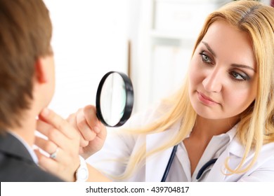 Beautiful Female Medicine Doctor With Serious Face Examine Patient. Medical Care, Illness Diagnosing, Physical, Physician Consultation, Insurance Concept. Dermatologist Or Oncologist Examination