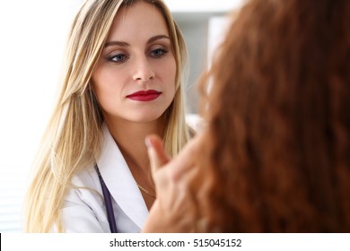 Beautiful Female Medicine Doctor With Serious Face Examine Patient. Medical Care, Illness Diagnosing, Physical, Physician Consultation, Insurance Concept. Dermatologist Or Oncologist Examination