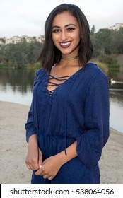 Beautiful Female Model Standing By A Lake