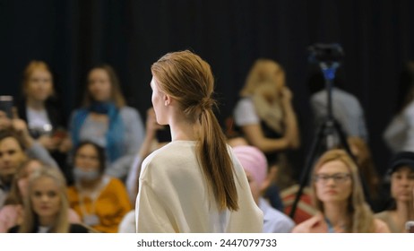 Beautiful female model walking down runway podium. Women on fashionable expo week. Haute couture catwalk, elegant people vogue. Beauty girl catwalks on fashion show stage, delicate person defile look. - Powered by Shutterstock