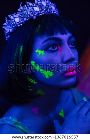 Beautiful female as nefertity in neon light