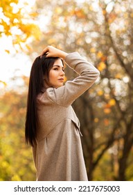 Beautiful Female Office Worker Has Fun In Autumn Park During Lunch Time Orange, Yellow Leaves Trees On Background, Walking Outdoors. Relaxation, Enjoying,solitude With Nature. Stress Relief.Vertical