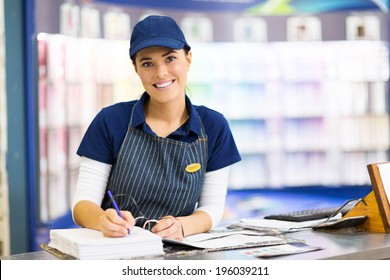 Beautiful Female Paint Store Clerk Working