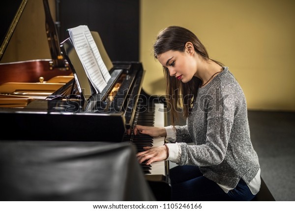 Beautiful female\
pianist