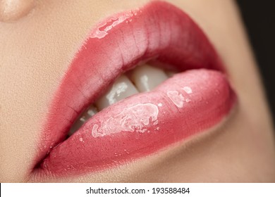 Beautiful Female With Pink Shiny Lips Close Up.