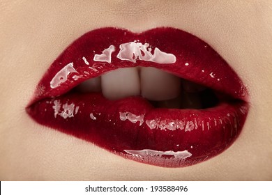 Beautiful Female With Red Shiny Lips Close Up.